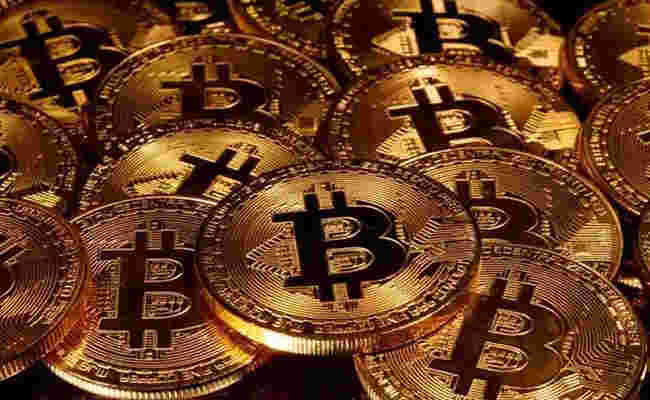 Bitcoin crosses $34,000 into New Year